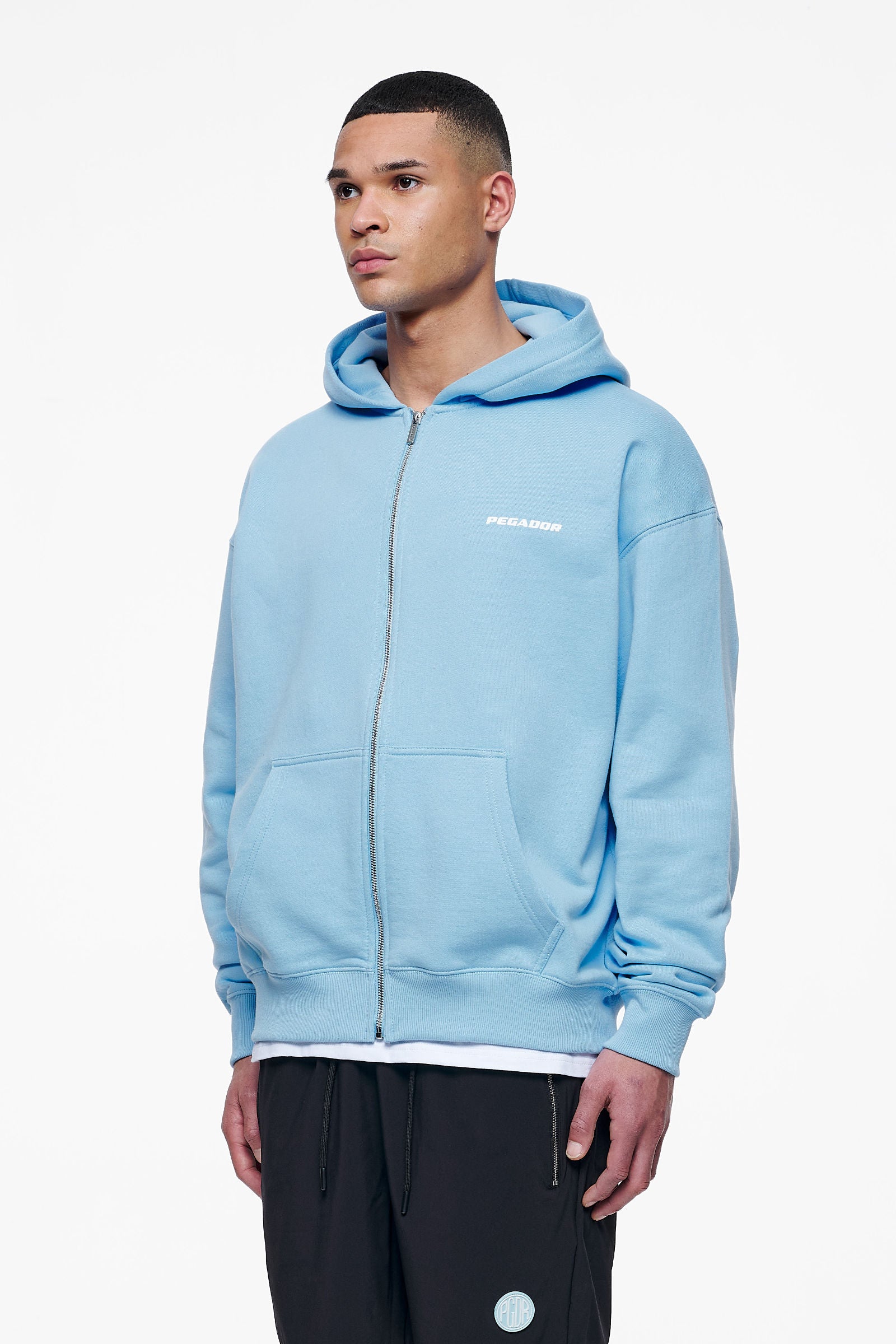 Pegador Colne Logo Oversized Sweat Jacket Vintage Washed Riviera Blue Gegenansicht aus der Finer Things Kollektion für Herren