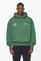 Pegador Dike Oversized Hoodie Vintage British Green Seitenansicht aus der Built to Last Kollektion für Herren