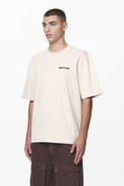 Pegador Crail Oversized Tee Washed Dust Cream Gegenansicht aus der Do not Disturb Kollektion für Herren